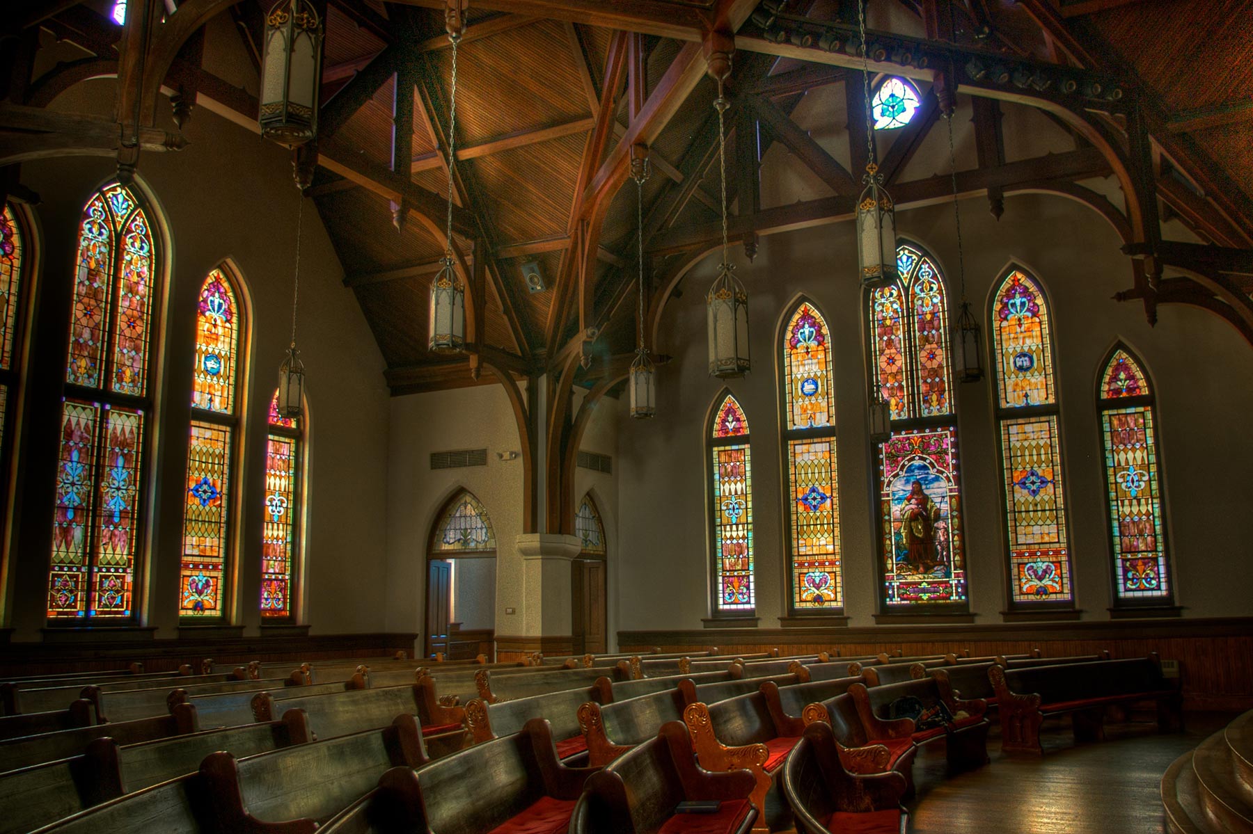 Stained glass windows inside of a chapel