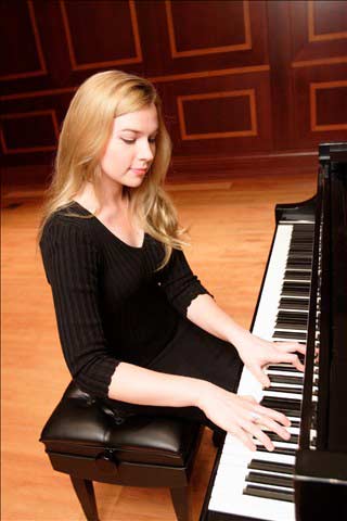 Woman seated playing piano