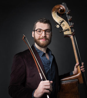 Daniel Tosky holding a double bass