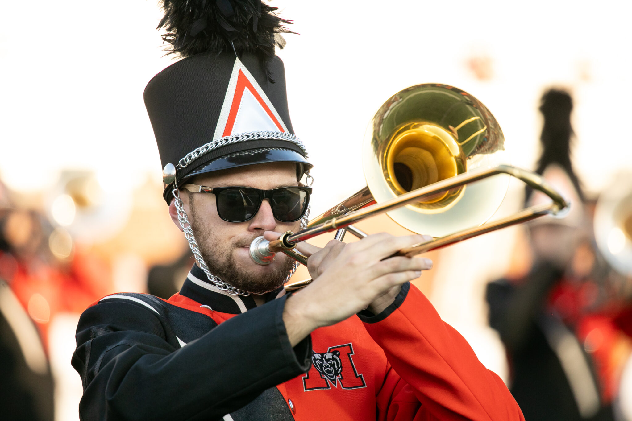 Marching Band member plays the trombone