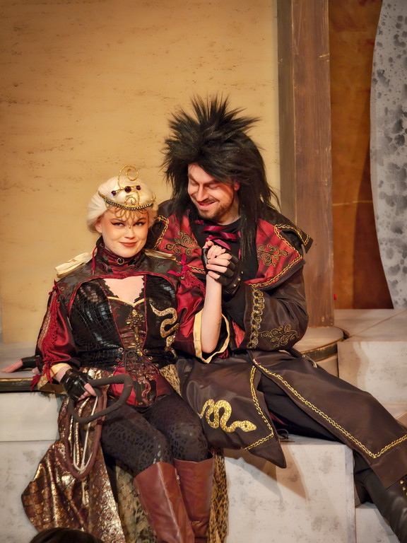 A male and female opera singers on stage