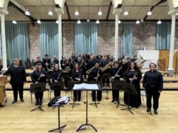 students in Wind Ensemble standing after performance in Manchester