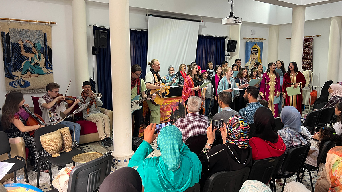 People playing music on stage during a worship service