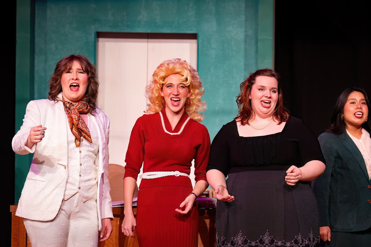 Three characters from 9 to 5 the Musical on stage