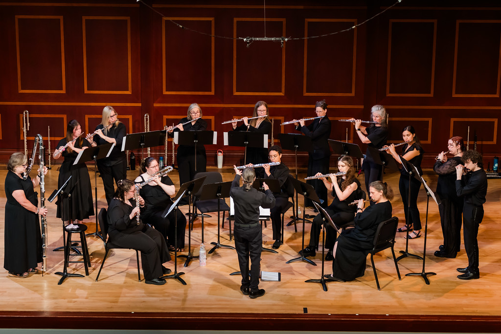 Flute choir performs on stage