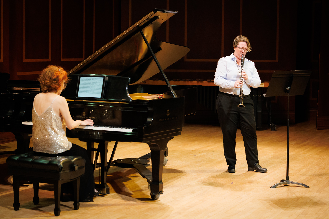 A clarinetist on stage with a collaborative pianist