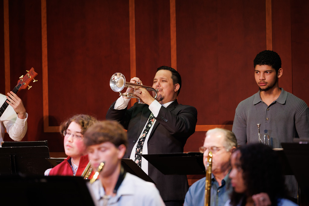 trumpet player on stage with jazz ensemble