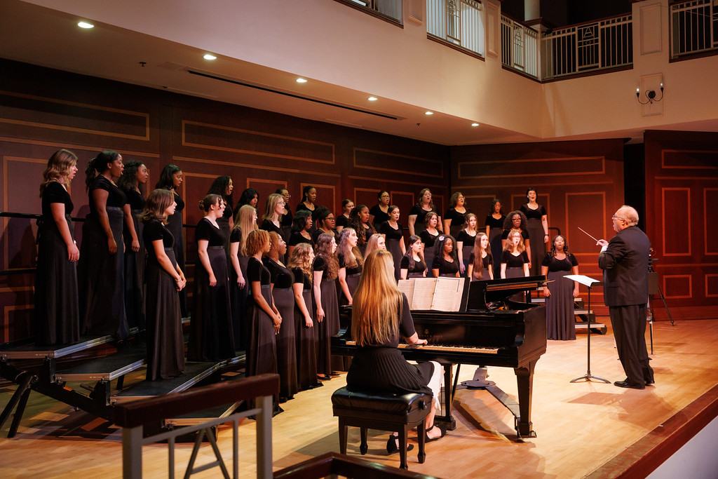 Mercer Women's Chamber Choir perform on stage in Fickling Hall