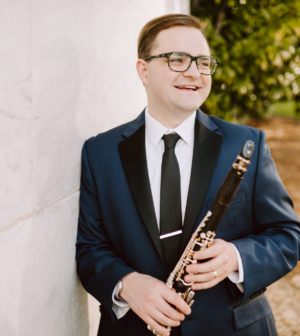 Bixby Kennedy headshot holding clarinet